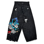 Black distressed wide-leg jeans with colorful anime-style warrior graphic on left leg