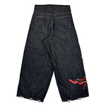 Black wide-leg denim shorts with rear pockets and red graphic detail on right leg