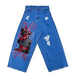 Blue distressed denim jeans with embroidered anime character and red lightning design