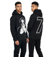 Young man modeling black graphic hoodie with abstract face design on front and large number 7 on back