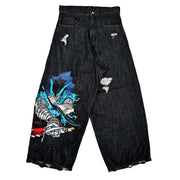 Black distressed wide-leg jeans with colorful anime-style warrior graphic on left leg